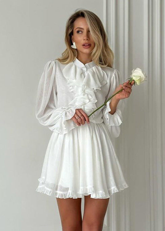 woman in white dress holding white rose