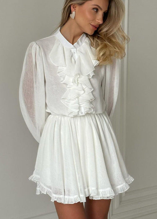 woman in white dress looking to the side