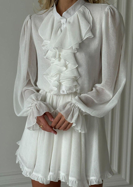 close-up of woman's torso in white dress