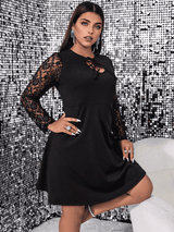 woman in black dress posing with hand on hip