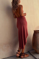 Back view of a woman in a rose asymmetrical hemline dress