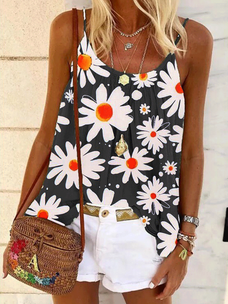 Woman wearing a black tank top with a white daisy print, white shorts, and a woven crossbody bag.