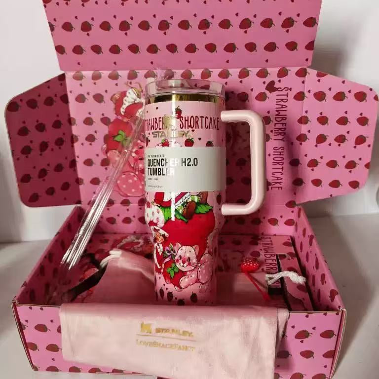 Stanley 40oz Sweet Berry Daydream Tumbler with pink Strawberry Shortcake artwork and ergonomic handle - View 3 | Clistos
