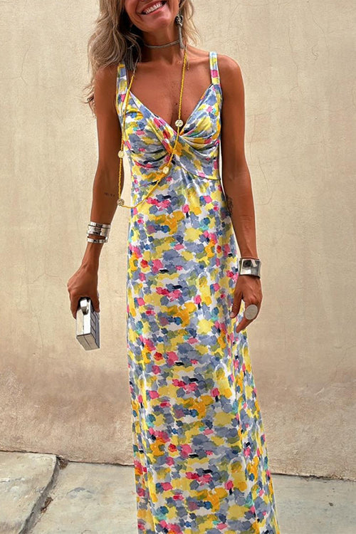 Full body shot of a woman in a floral maxi dress