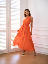 woman posing in an orange dress