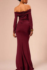 Back view of a woman in a long, off-the-shoulder maroon dress with ruched detailing.