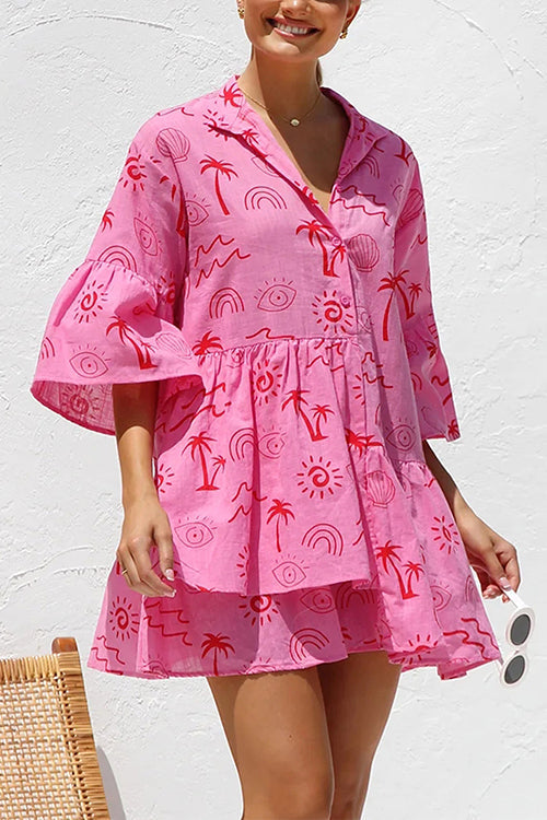 Close-up of a woman in a pink printed dress.