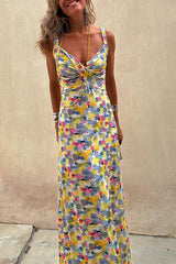 Woman posing in a vibrant maxi dress