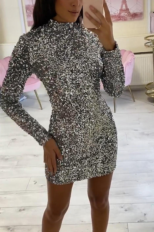 woman in silver sequin mini dress