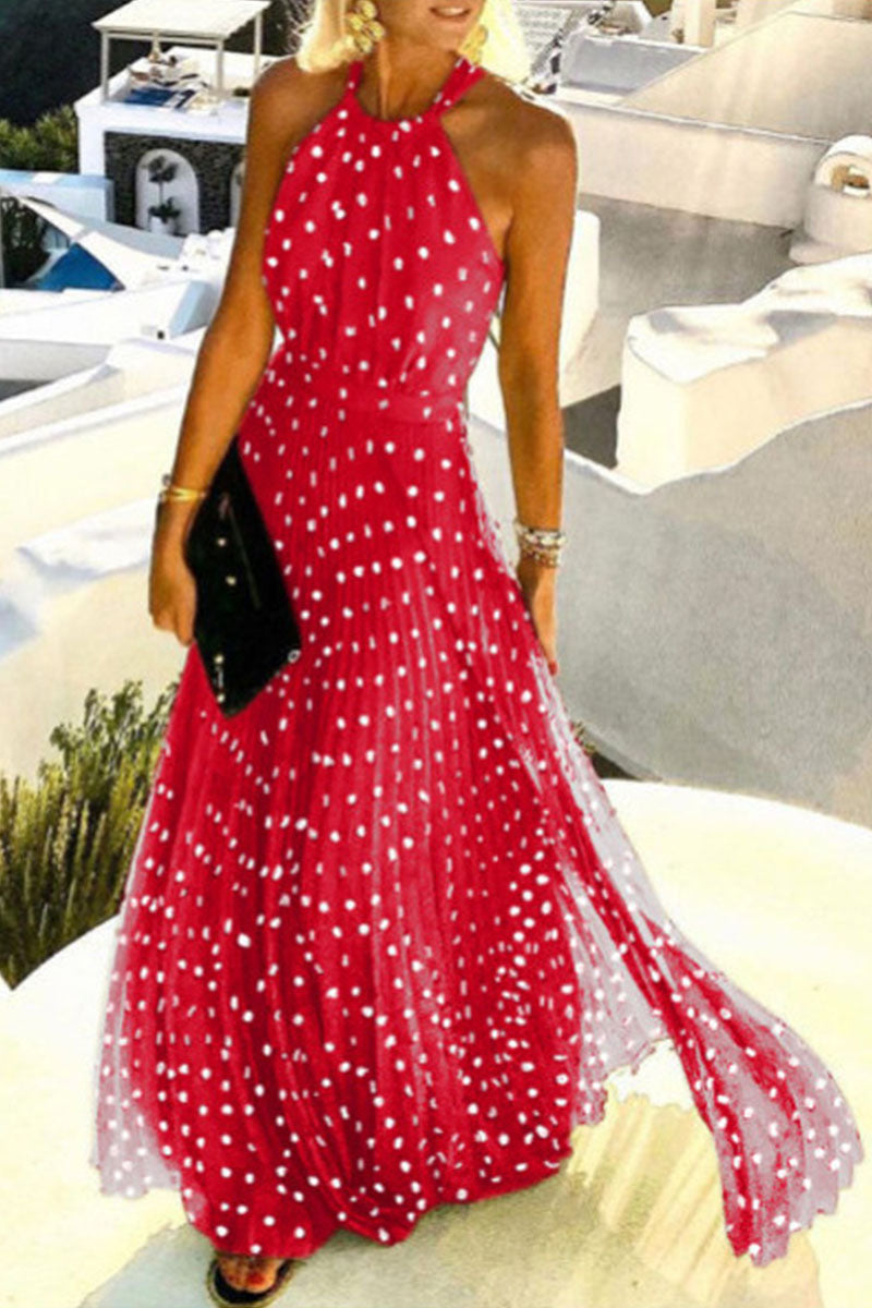 woman in a red polka dot maxi dress