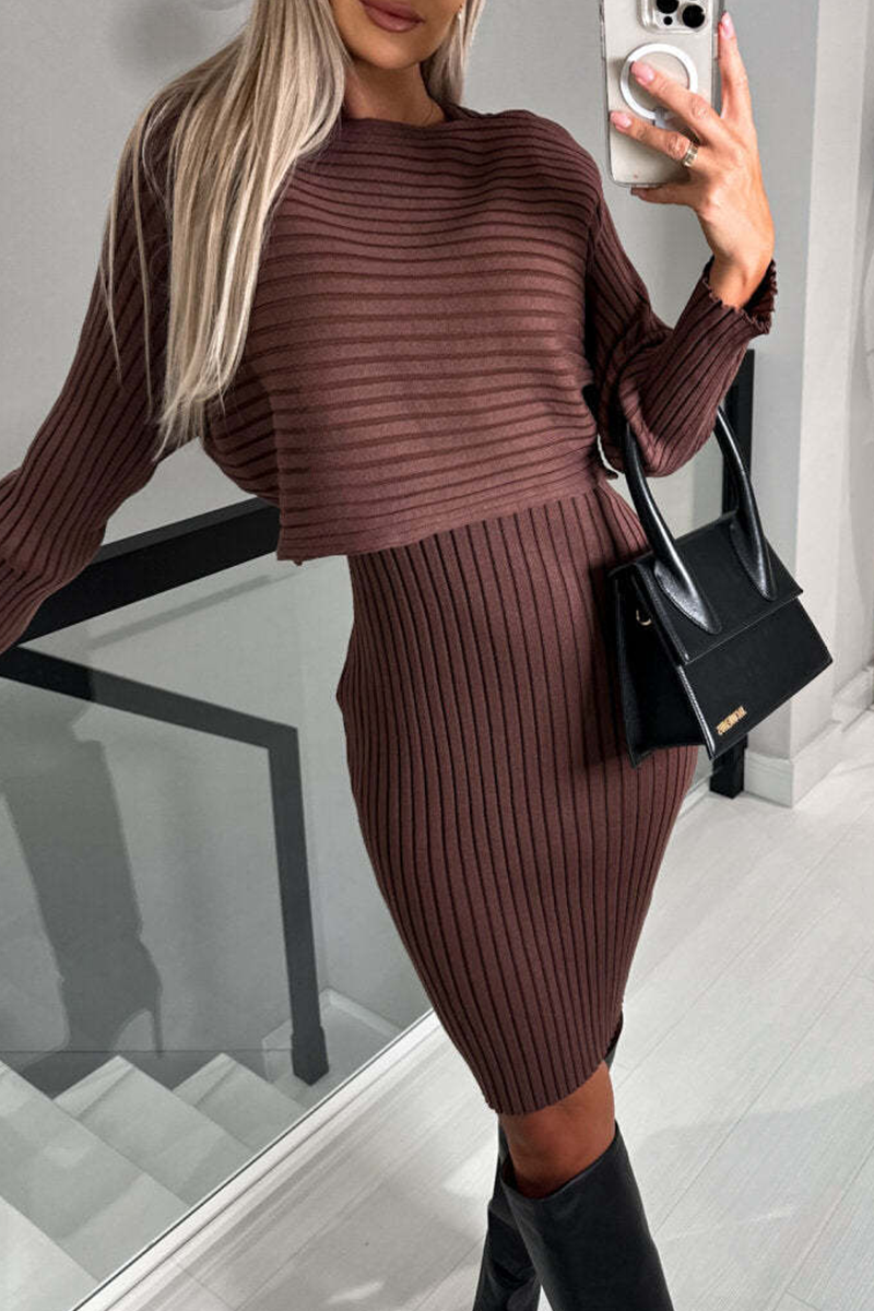 Woman in a brown ribbed knit sweater dress and black boots