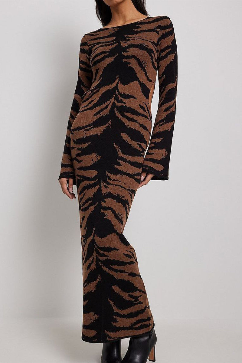 Woman in a tiger-print midi dress, front view.