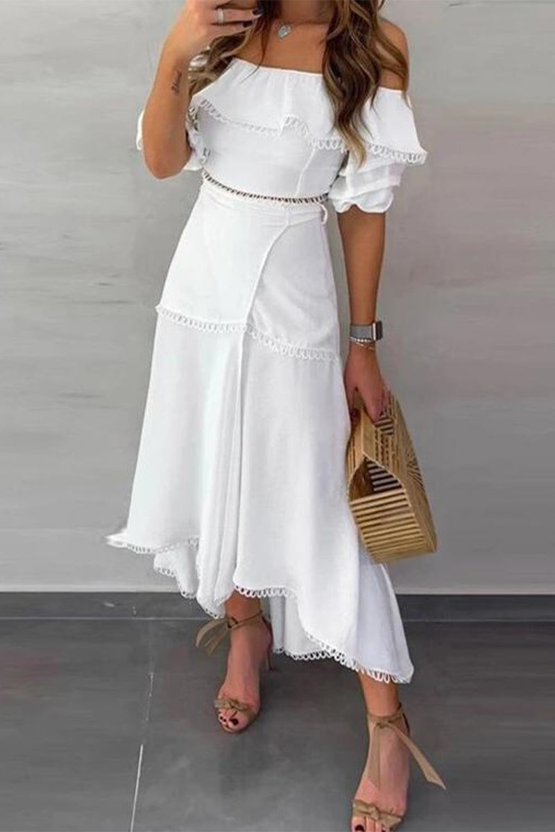 Close-up of the white dress showing the lace trim and wrap skirt detail