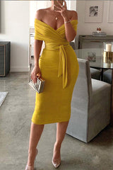 woman wearing a yellow off-the-shoulder midi dress with a belted waist