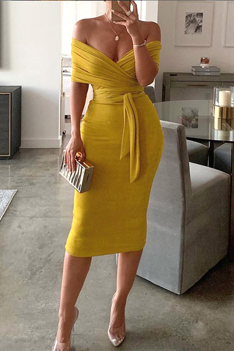 woman wearing a yellow off-the-shoulder midi dress with a belted waist