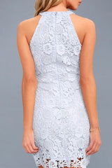 A woman models a light blue lace halter dress, back view.