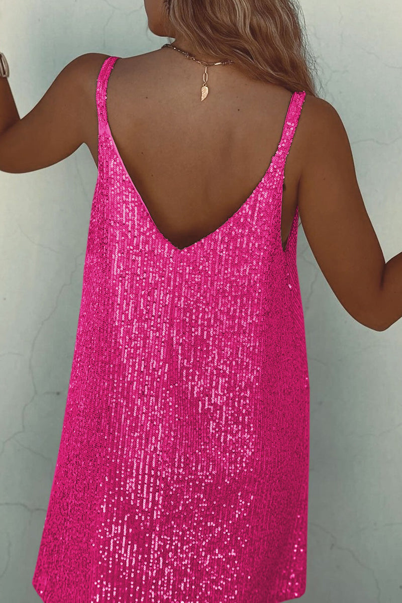 Back view of a woman in a hot pink sequined mini dress showing her back