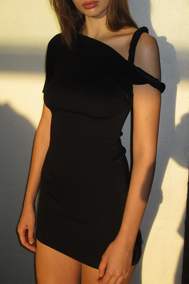 Woman wearing a black one-shoulder bodycon mini dress