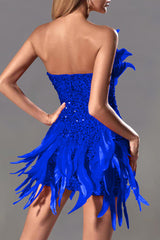 A woman wearing a blue strapless sequined mini dress with feather accents, shown from the back.