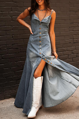 Close-up of a woman in a light wash denim maxi dress, showing the button-down detail and slit.