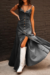 Close-up of a woman in a dark wash denim maxi dress, showing the button-down detail and slit.