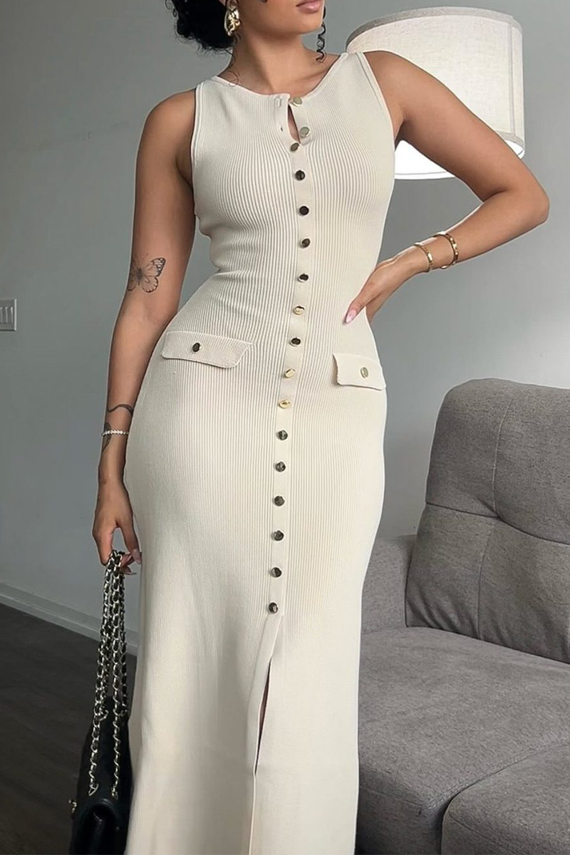 woman wearing a beige ribbed knit midi dress with gold buttons and pockets