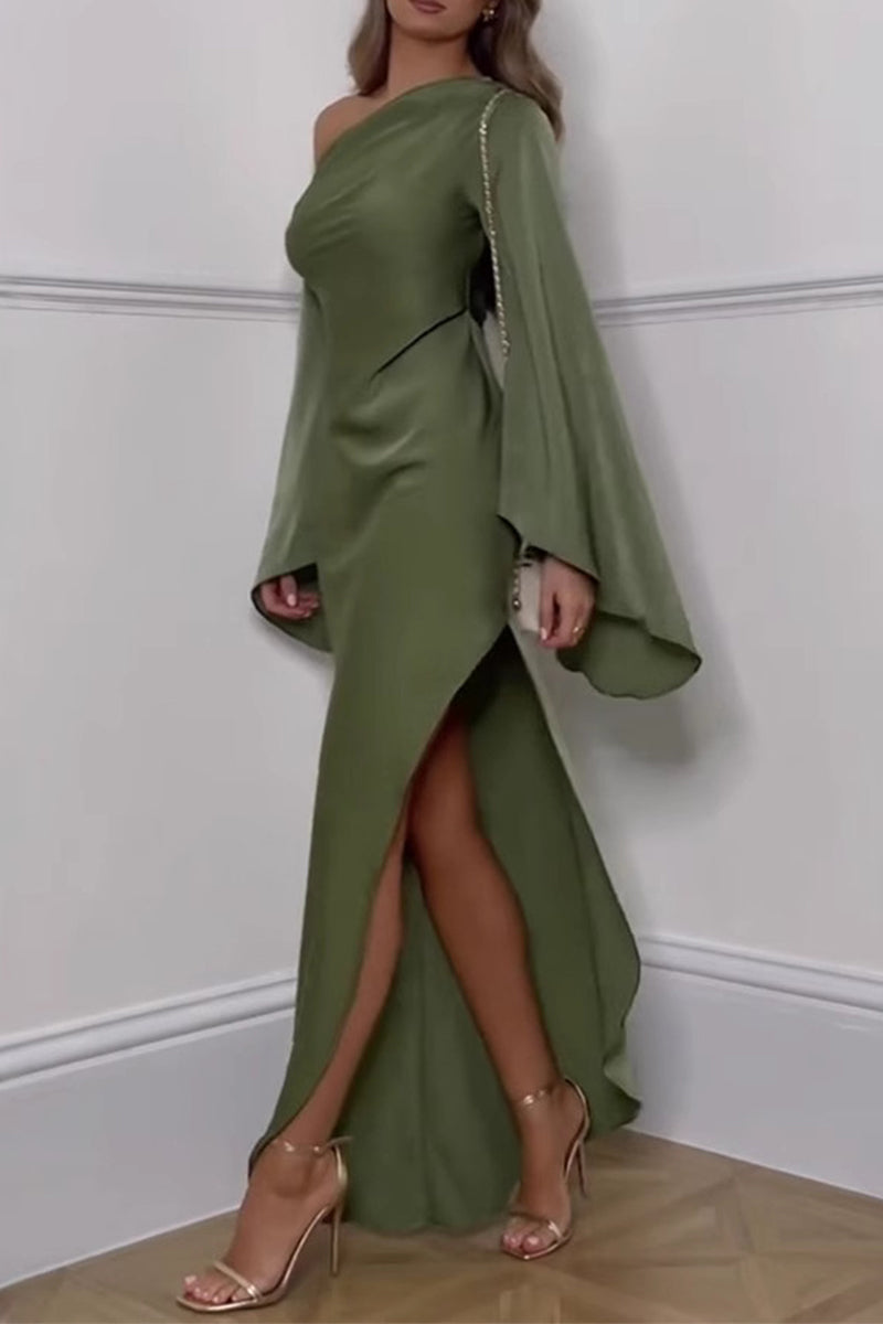 Close-up of the details of an olive green satin dress, highlighting the flowing fabric, one-shoulder neckline, and the dramatic flare of the bell sleeves.