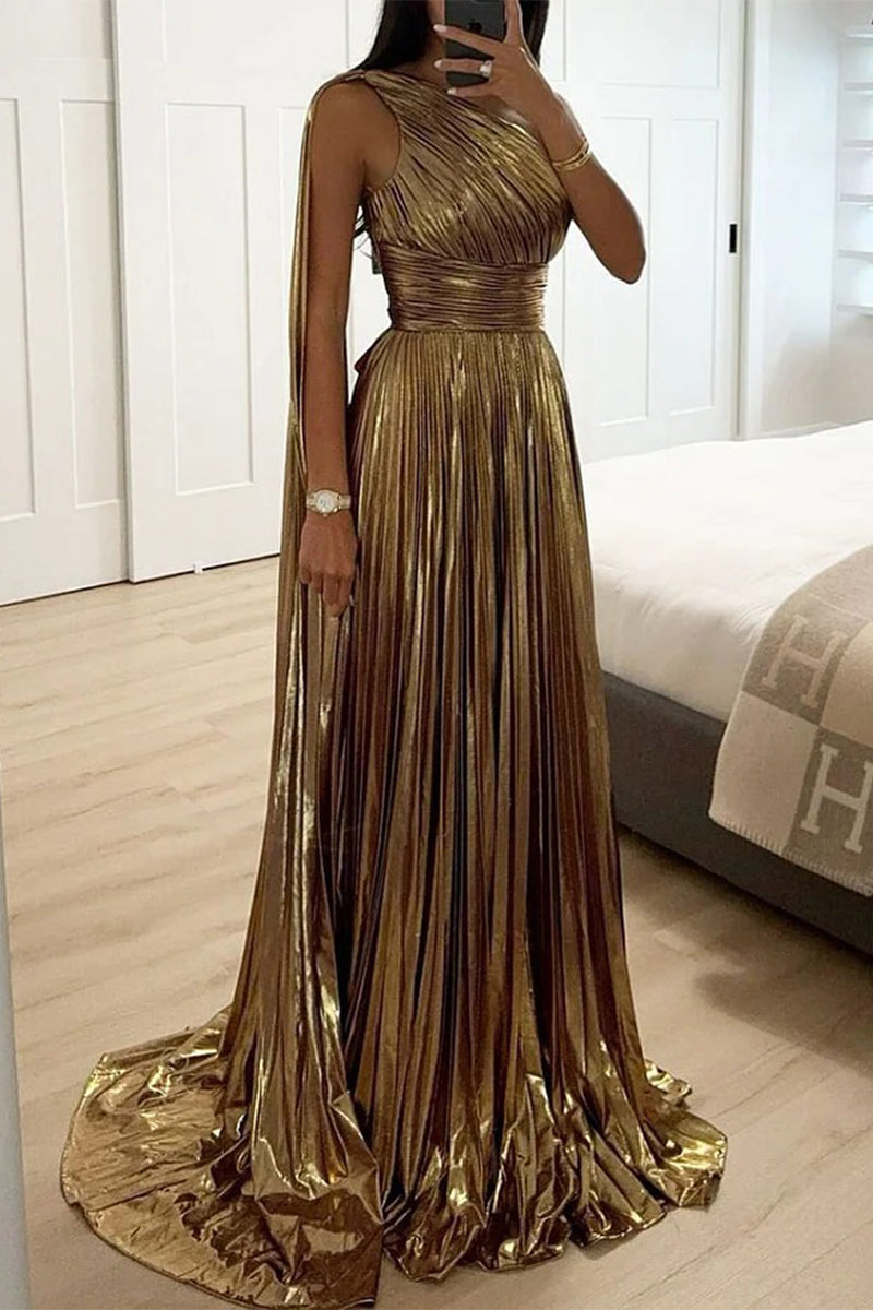 Full length view of a woman in a shimmering gold one-shoulder gown with a train.