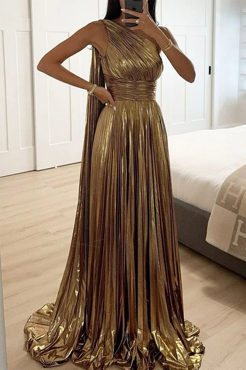 Woman wearing a long, flowing gold one-shoulder dress with intricate pleating.