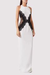 Model in a white and black lace halter neck gown