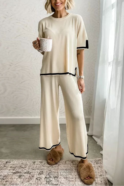 woman in beige loungewear set with black trim