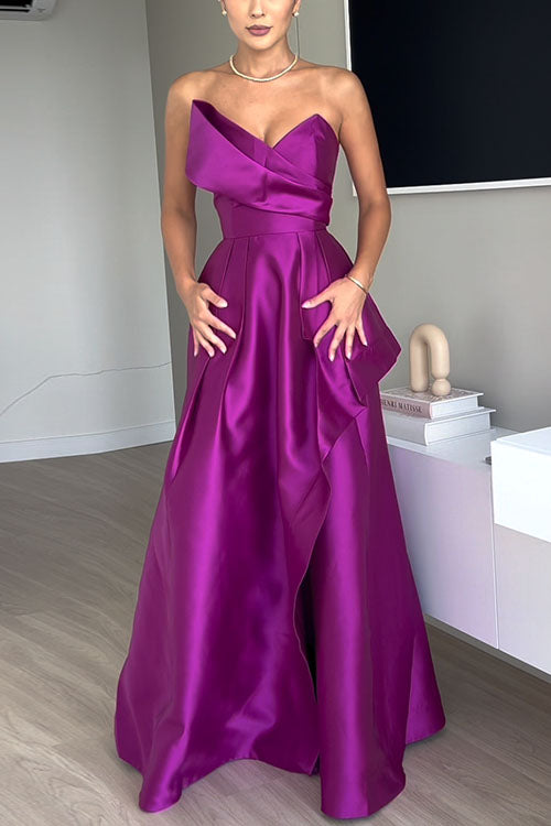 Woman in a vibrant purple satin evening gown with a strapless sweetheart neckline and a full, pleated skirt.