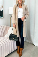 woman holding a black quilted handbag