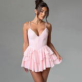 Woman in a pink ruffled dress from the front