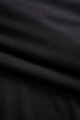 Close-up of the ribbed knit fabric of a black dress.