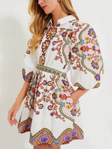 Close-up of the paisley print on the dress, showing intricate floral and geometric patterns.