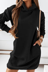 a woman wearing a black hoodie dress