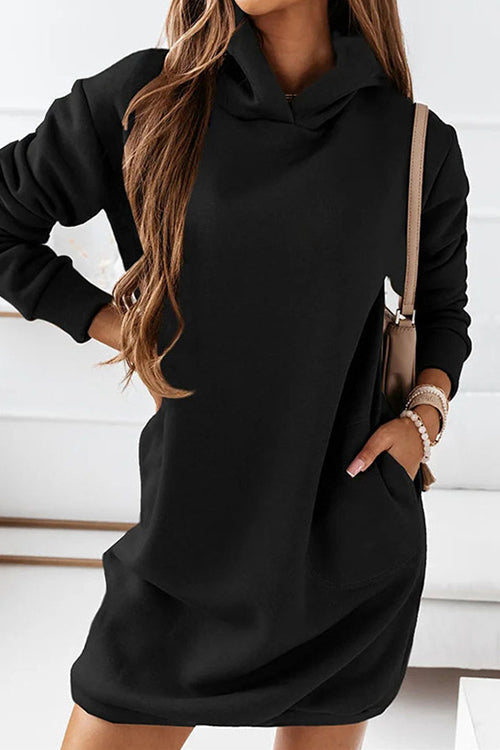 a woman wearing a black hoodie dress