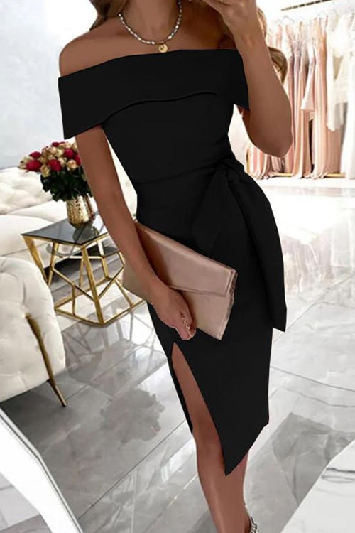woman in black off-the-shoulder dress with a bow belt and high slit