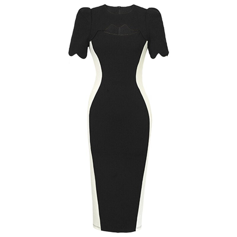 A black and white sheath dress displayed on a white background