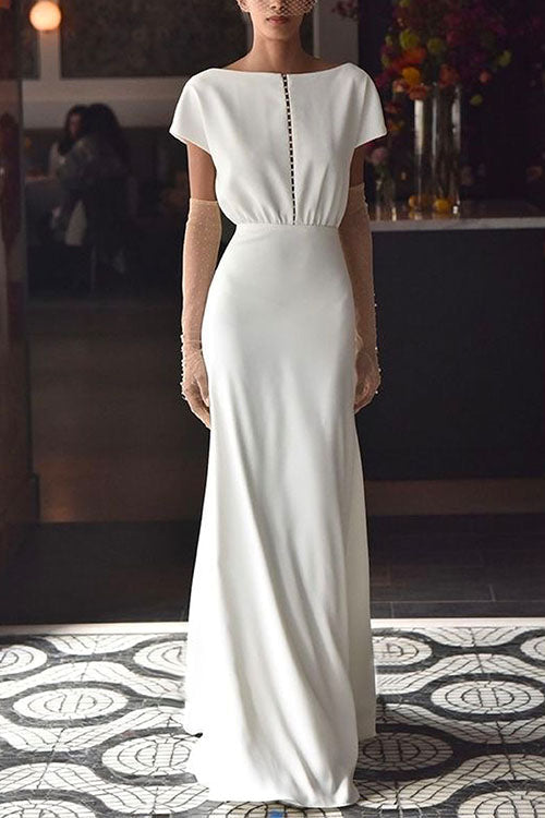 woman in white satin wedding dress with sheer dotted sleeves
