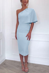 woman in a light blue one-shoulder dress