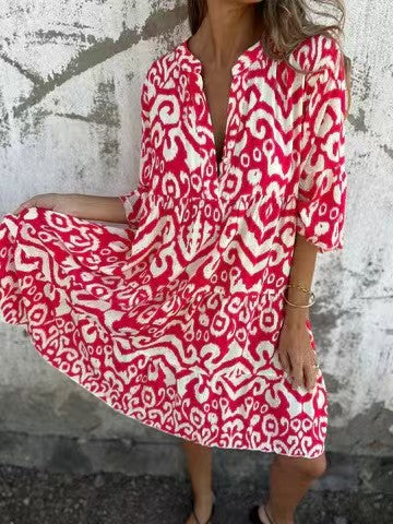woman wearing a red and white patterned dress
