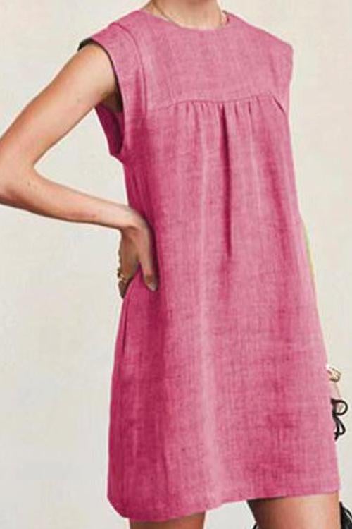 woman wearing a pink sleeveless dress