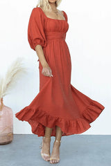 woman in a red midi dress with flowing skirt