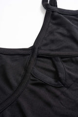 Close-up of the keyhole neckline and strap detail of a black dress.