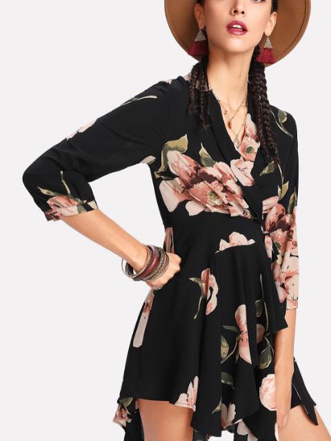 woman in a black floral wrap dress with a hat