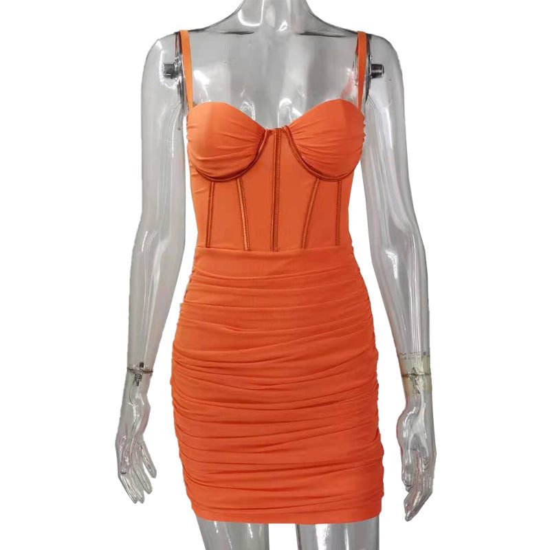 orange ruched mini dress with a corset bodice on a mannequin