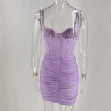 Back view of a lavender ruched mini dress with a corset bodice on a mannequin