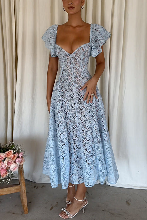Full body shot of a woman wearing a light blue lace midi dress